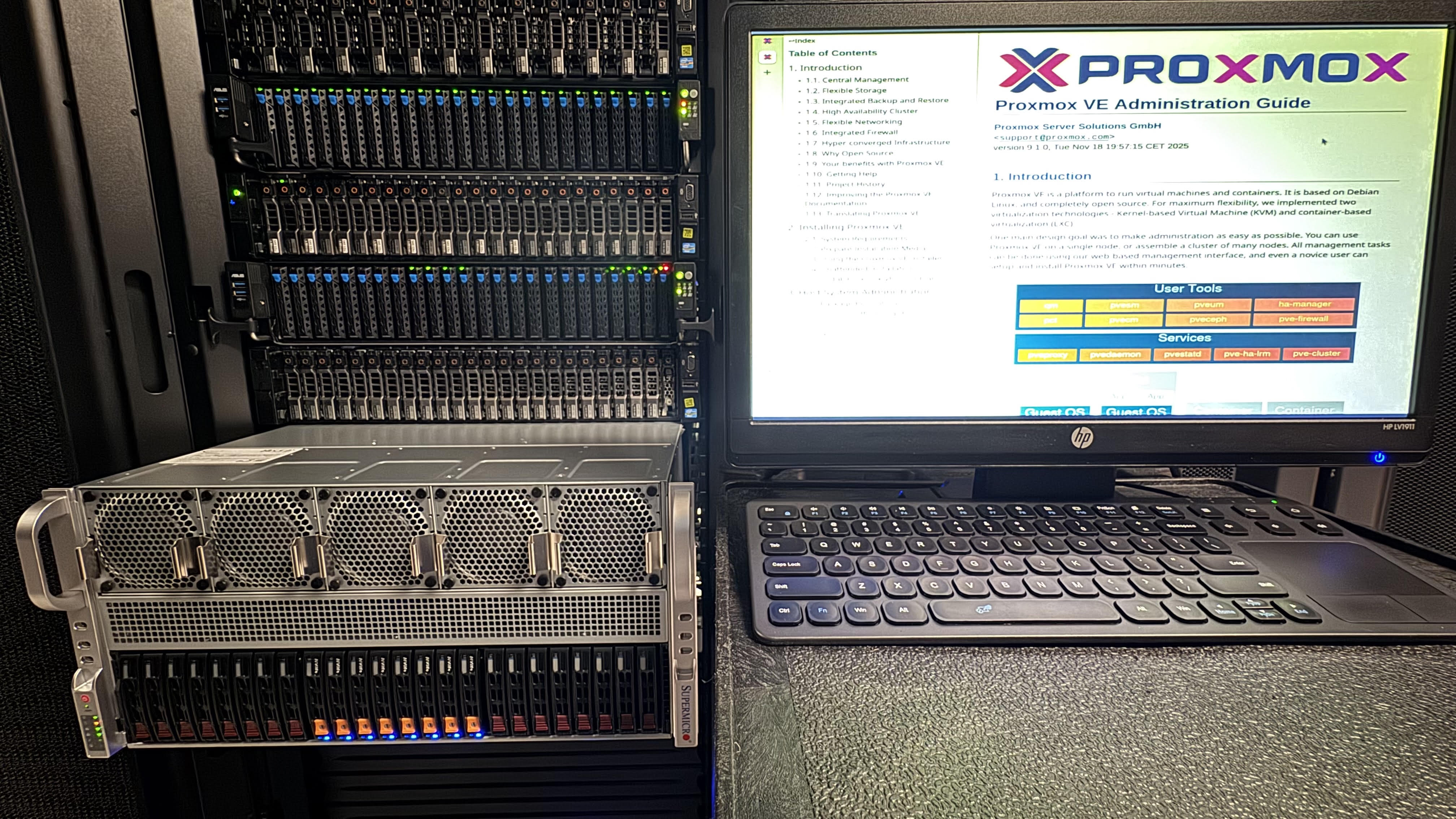 Server rack with a Supermicro GPU server in front and a monitor showing the Proxmox VE administration guide